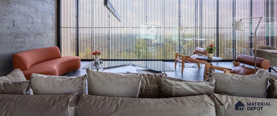 a living room filled with lots of furniture and a large windows in the center of it next to a window covered in front of a window covered in a room filled with lots of plants and bookshelves covered